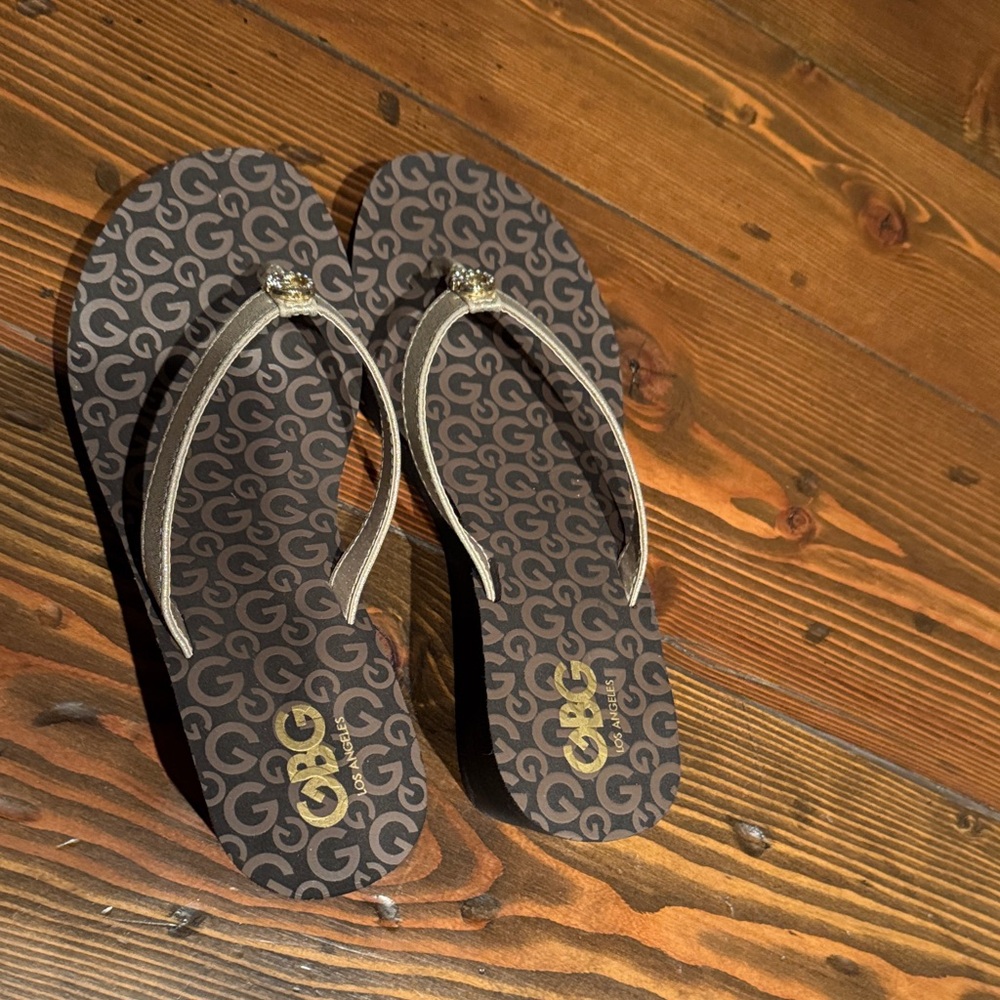 G by Guess Black and Gold Sandals